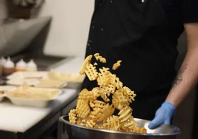 Tossing waffle fries