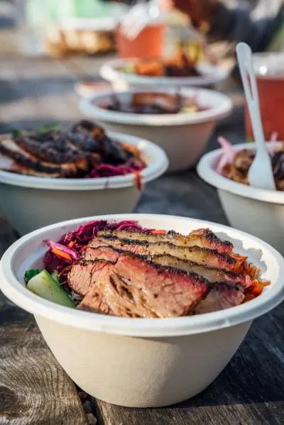 An array of rice bowls on a picnic table