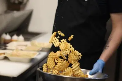 Tossing waffle fries