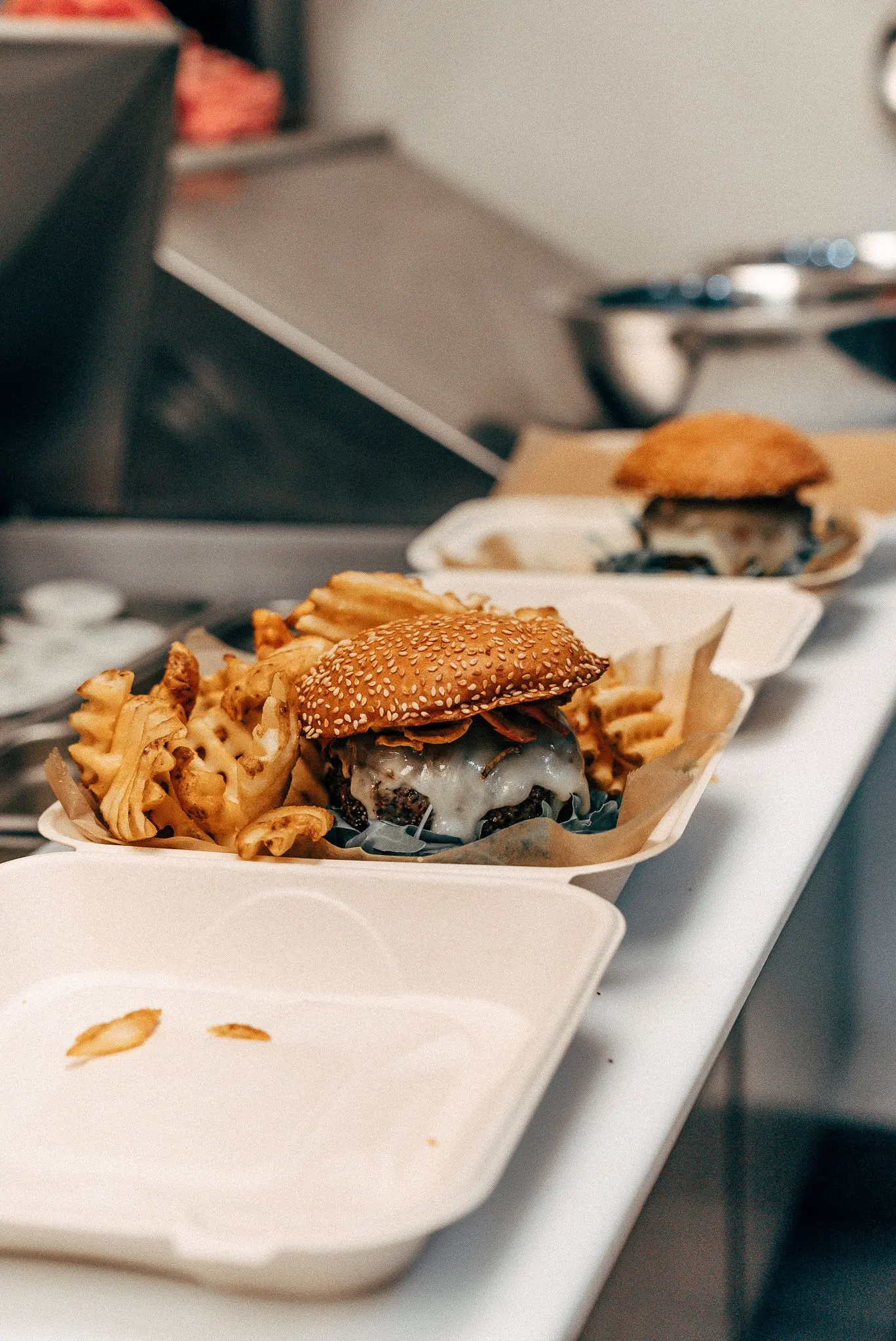 Hamburgers in to go containers